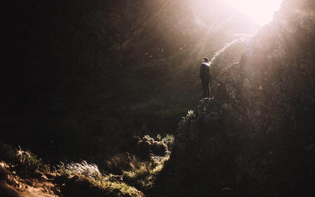 Man looking towards the light illustrating the action required of faith. Faith works!